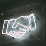 neon handshake